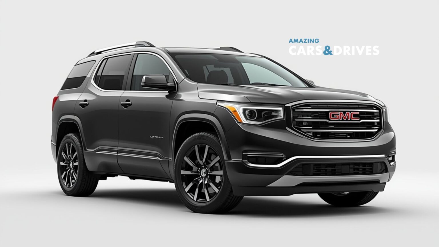 A dark gray 2026 GMC Acadia Denali SUV is parked on a plain white background, viewed from the front left angle, with "Amazing Cars & Drives" text in the background.